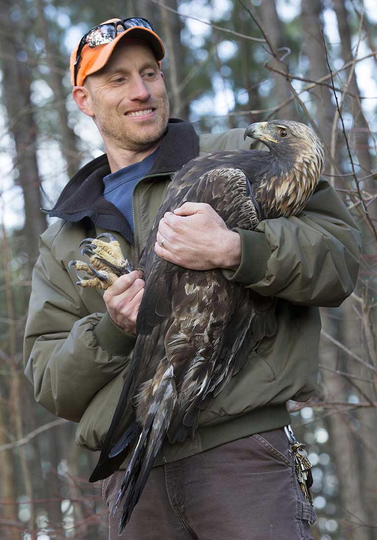 Eric Soehren holding a Golden Eagle